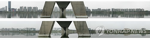 From Yonhap, copy of part of the series of photographs of Seoul as seen on the North and South sides of the Han river.