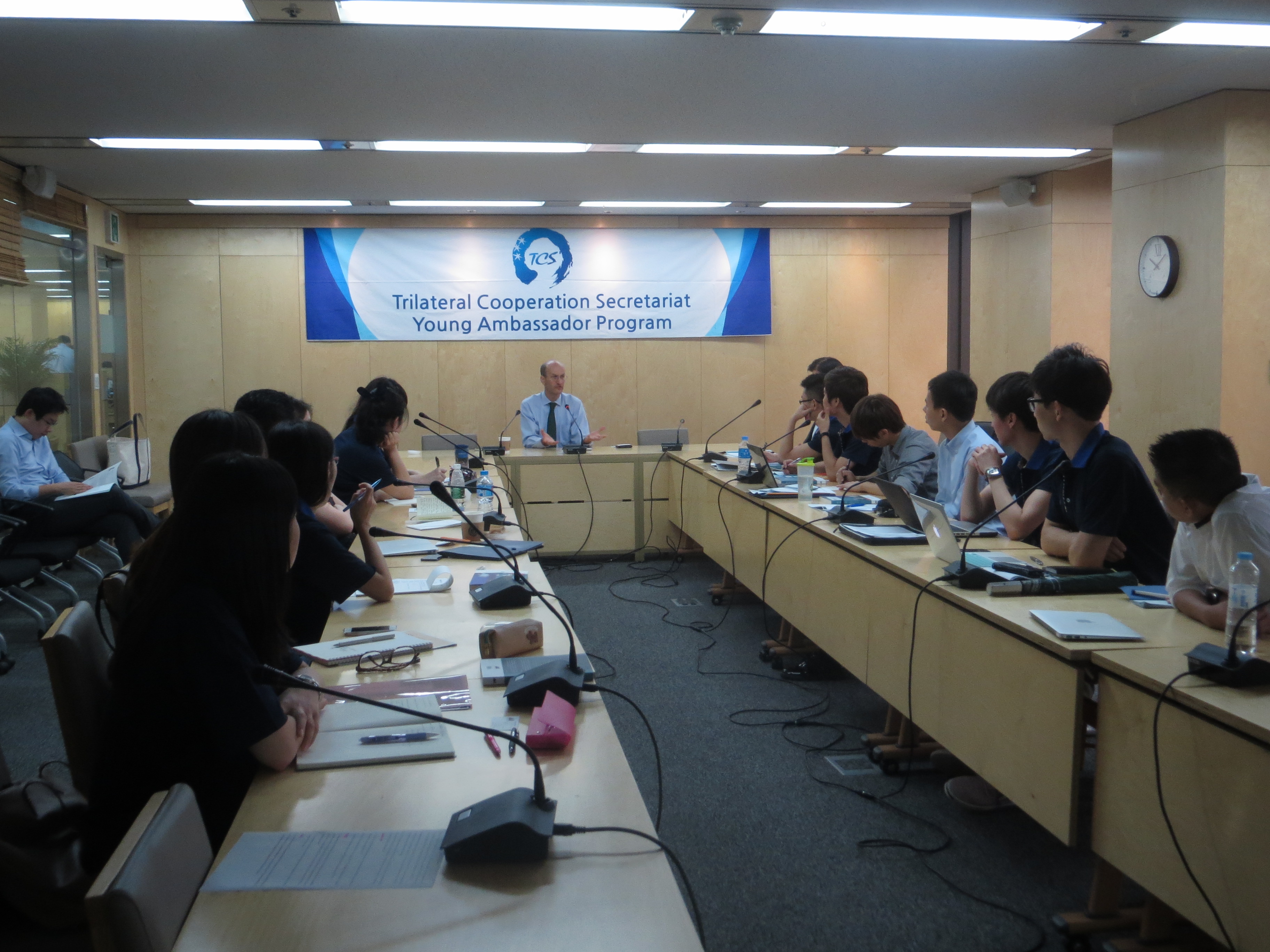 Emanuel leads students from China, Japan and Korea in a discussion of cooperation in East Asia at the Young Ambassadors Program at the Trilateral Cooperation Secretariat in Seoul.