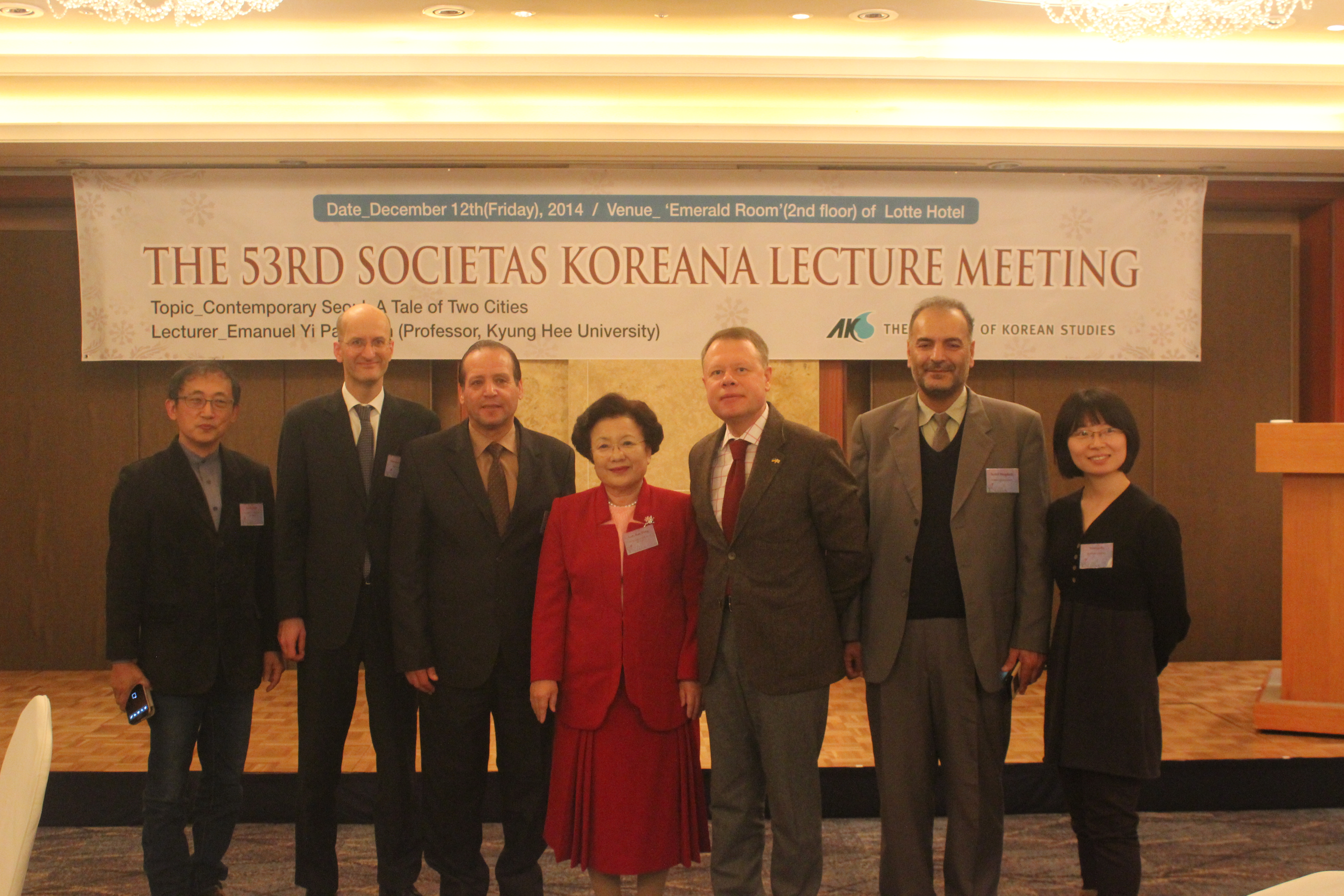 Dr. Lee Yong Bae is in the center in a red dress. 