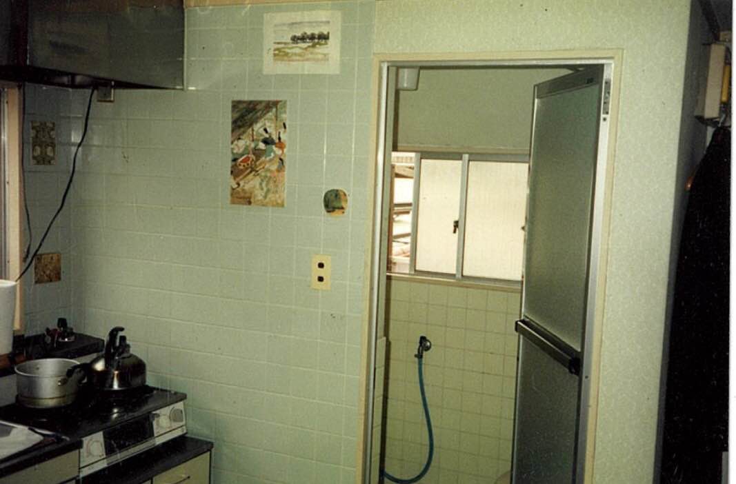 The kitchen with a view of the bathroom.